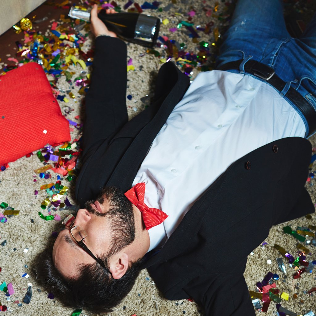 Man passed out on floor from alcohol poisoning
