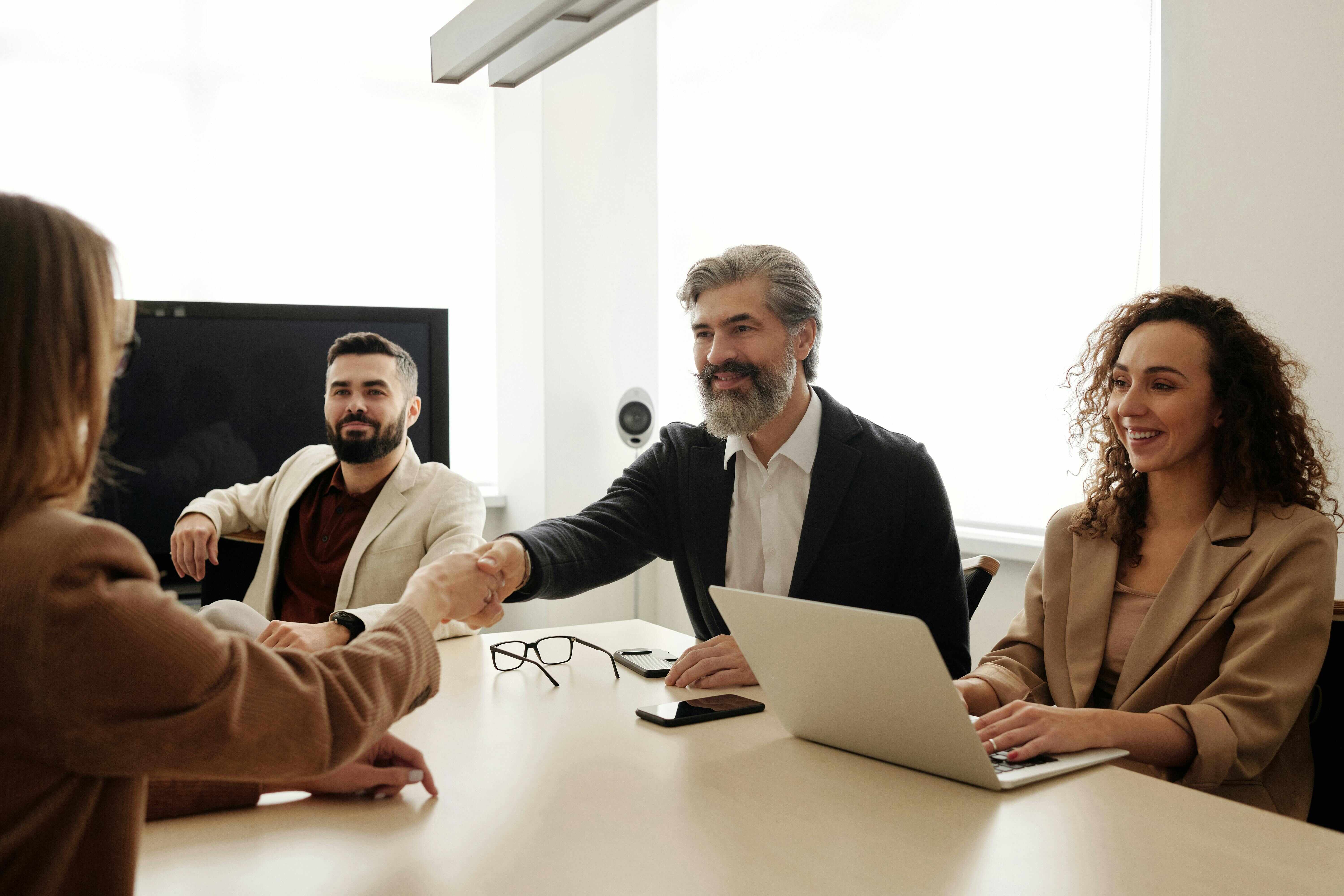 multi-ethnic group of government employees meeting