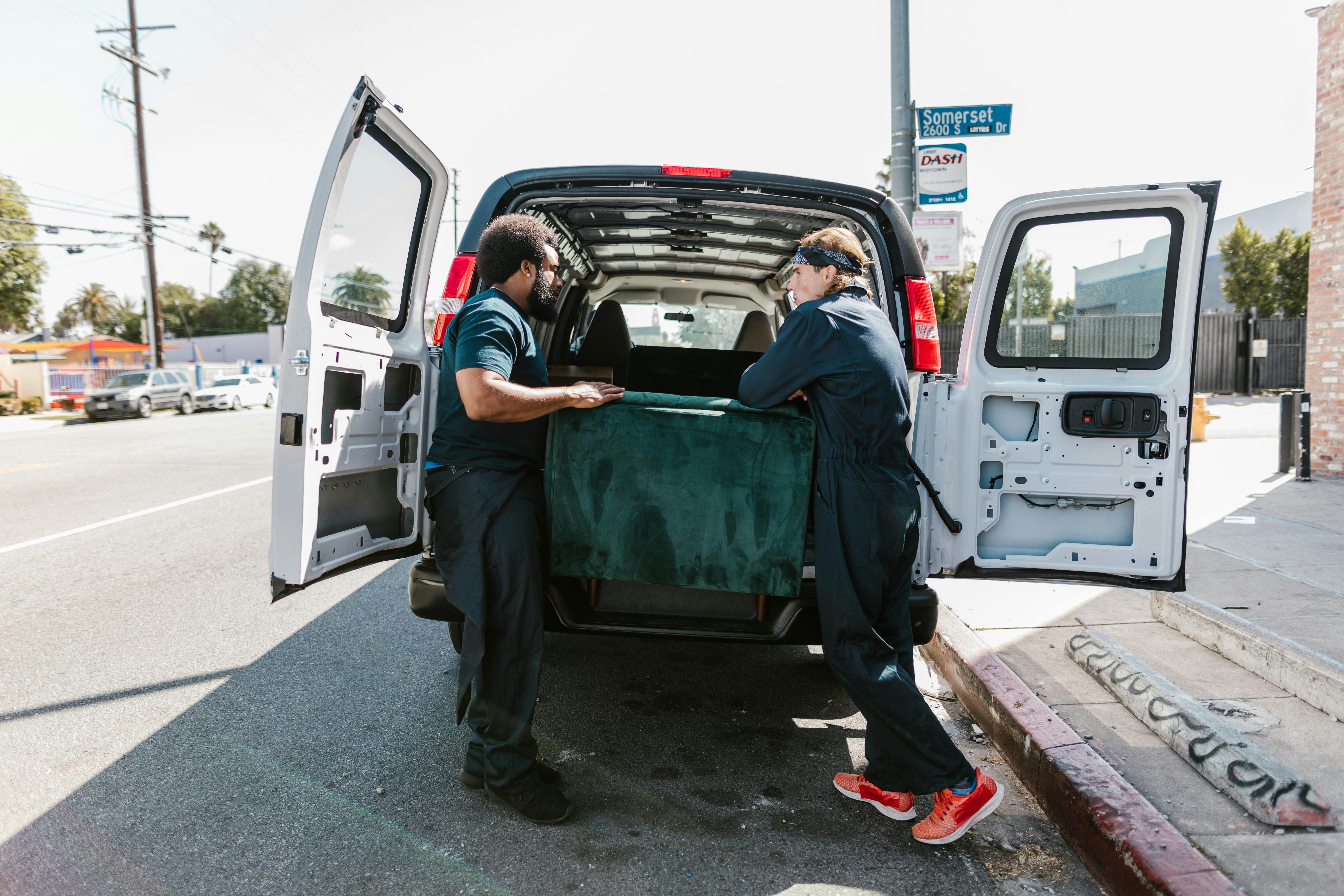 CPR training instructors unloading equipment from van for on-site first aid training in Los Angeles