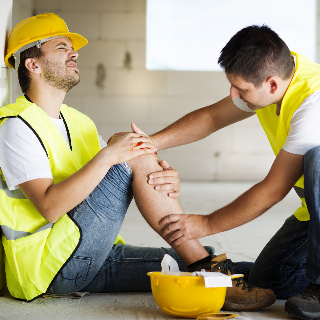 Coworker checking on hurt worker